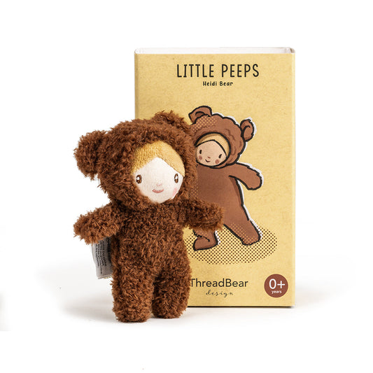 Brown plush toy bear with packaging labeled 'Little Peeps' on a white background