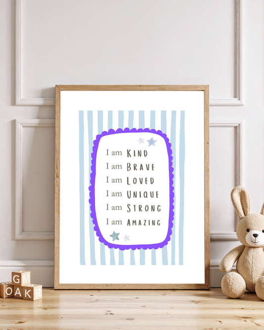 Nursery affirmation wall art print featuring positive “I am” statements in a wooden frame with blue striped background, styled in a neutral children’s room with teddy bear décor.