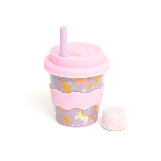 Pink tumbler with animal prints on a white background